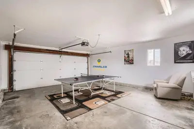 a room with a ping pong table in a garage at Centrally located for adventures in Westminster