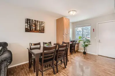a dining room with a table and chairs at Centrally located for adventures in Westminster
