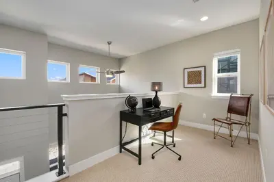 a home office with a desk and two chairs at Exquisite Home by Old Town - Steps from Poudre Trail in Fort Collins