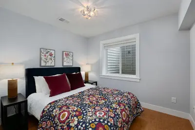 a bedroom with a large bed and a window at Exquisite Home by Old Town - Steps from Poudre Trail in Fort Collins