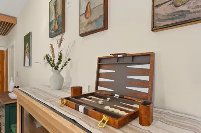 a briefcase sitting on top of a wooden table at The Hattie House in Old Town - Walk Everywhere! in Fort Collins