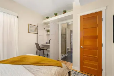 a bedroom with a bed and a desk at The Hattie House in Old Town - Walk Everywhere! in Fort Collins