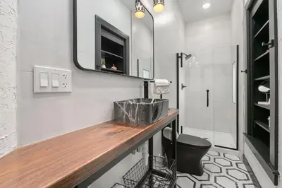 a bathroom with a sink and a shower at Old Town Retreat with Hot Tub - Steps from CSU! in Fort Collins