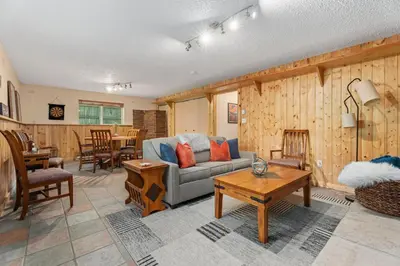 a living room with a couch and a table at Close to Trails, Parks & Open Space! Amazing Yard! in Fort Collins