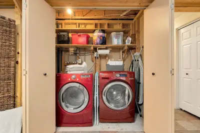 a laundry room with two washing machines in it at Close to Trails, Parks & Open Space! Amazing Yard! in Fort Collins