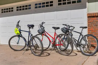 three bikes parked in front of a garage at Close to Trails, Parks & Open Space! Amazing Yard! in Fort Collins