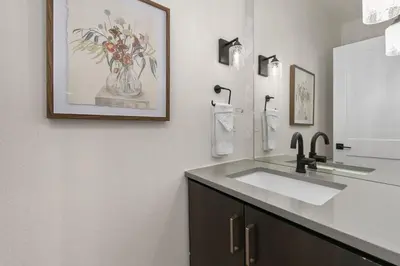 a bathroom with a sink and a mirror at Coastal Chic Home near New Belgium & Old Town FC in Fort Collins
