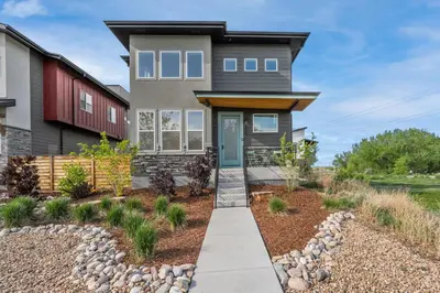 a home with a pathway leading to the front door at Coastal Chic Home near New Belgium & Old Town FC in Fort Collins
