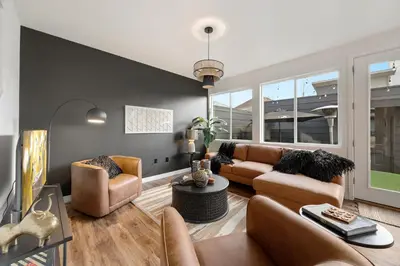 a living room with a couch and chairs at Coopers North in Old Town - Hot Tub & Pool Table! in Fort Collins