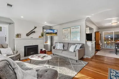 a living room with a couch and a fireplace at Historic Mountain Ave Bungalow - Walk Everywhere! in Fort Collins