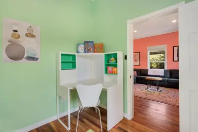 a room with a white desk and a chair at The Magnolia House in Old Town - Private Hot Tub in Fort Collins