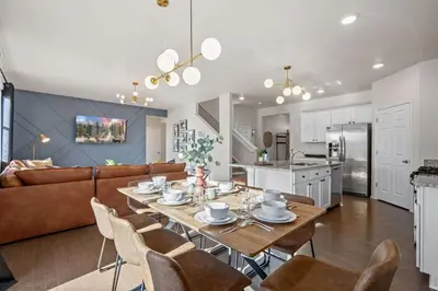 a kitchen and living room with a table and chairs at NEW! Family-friendly Home with Pool Table, King Beds in Windsor