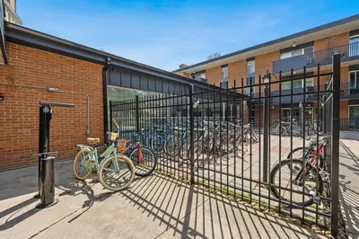 a group of bikes parked in front of a building at The Fox Den in Old Town! Pool, Sauna & Game Room in Fort Collins