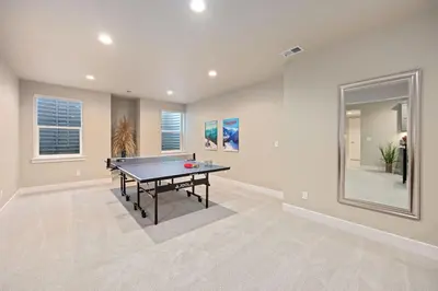 a dining room with a ping pong table in it at NEW! Elegant Home near TPC Golf Course & Trails in Loveland