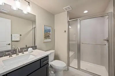 a bathroom with a shower and a toilet and a sink at NEW! Elegant Home near TPC Golf Course & Trails in Loveland
