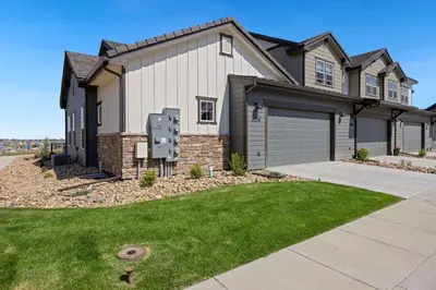 a house with a driveway and a garage at NEW! Elegant Home near TPC Golf Course & Trails in Loveland
