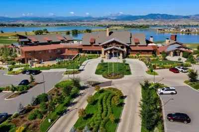 an aerial view of a large house with a parking lot at NEW! Elegant Home near TPC Golf Course & Trails in Loveland