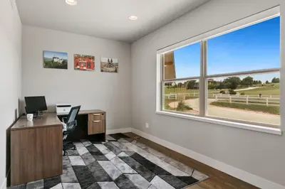 an office with a desk and a window at Luxury Home with Spectacular Rocky Mountain Views! in Eaton
