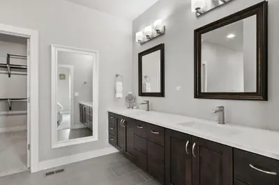 a bathroom with a large sink and a mirror at Luxury Home with Spectacular Rocky Mountain Views! in Eaton