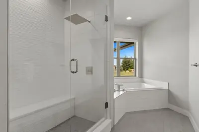a white bathroom with a shower and a sink at Luxury Home with Spectacular Rocky Mountain Views! in Eaton
