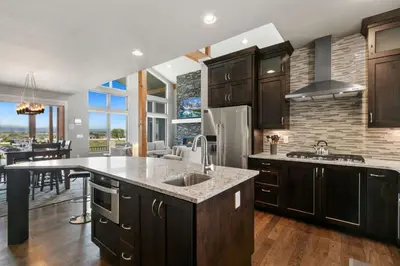 a kitchen with a sink and a counter top at Luxury Home with Spectacular Rocky Mountain Views! in Eaton