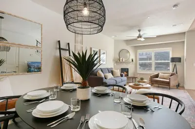 a dining room and living room with a table and chairs at Urban Oasis near Breweries & Old Town - Free Bikes in Fort Collins