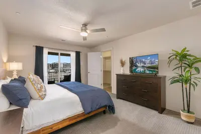 a bedroom with a bed and a dresser and a window at Urban Oasis near Breweries & Old Town - Free Bikes in Fort Collins