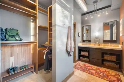 a bathroom with a sink and a mirror at Penthouse with Mountain Views in the Heart of Old Town in Fort Collins