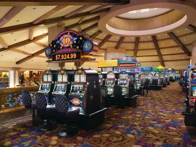 a row of slot machines in a casino at Ameristar Casino Black Hawk in Black Hawk