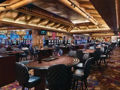 a bar with tables and chairs in a casino at Ameristar Casino Black Hawk in Black Hawk