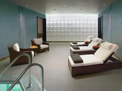 a living room with couches and chairs and a pool at Ameristar Casino Black Hawk in Black Hawk
