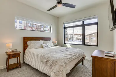 a bedroom with a bed and a ceiling fan at Ski-InandSki-Out Granby Ranch Retreat Pool Access! in Granby