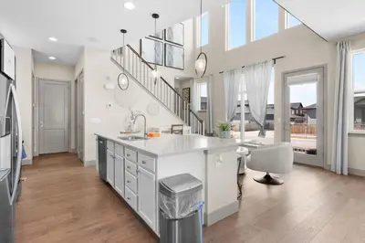 a kitchen with a sink and a counter top at Orleans Street - Aurora in Aurora