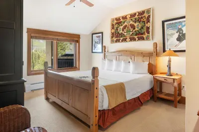 a bedroom with a large bed and a window at 3Br Ski-in Ski-out-On Mountain-Lone Eagle 3053 condo in Dillon