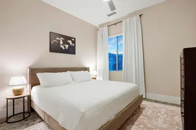 a white bedroom with a large bed and a window at Unbeatable Location Golden Condo - Walk Everywhere in Golden
