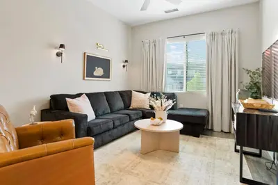 a living room with a couch and a table at Incredible Golden Location Close to Red Rocks and School of Mines in Golden