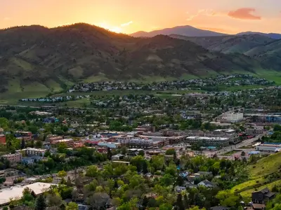 an aerial view of a city with mountains in the background at Incredible Golden Location Close to Red Rocks and School of Mines in Golden