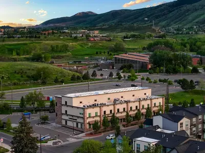 an aerial view of a town with mountains in the background at Incredible Golden Location Close to Red Rocks and School of Mines in Golden
