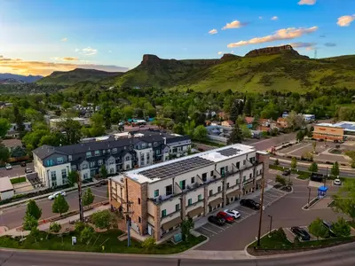 an aerial view of a town with a mountain in the background at Incredible Golden Location Close to Red Rocks and School of Mines in Golden