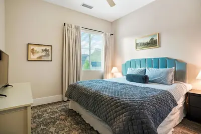 a bedroom with a blue bed and a window at Incredible Golden Location Close to Red Rocks and School of Mines in Golden