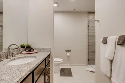 a bathroom with a sink and a toilet and a shower at Incredible Golden Location Close to Red Rocks and School of Mines in Golden