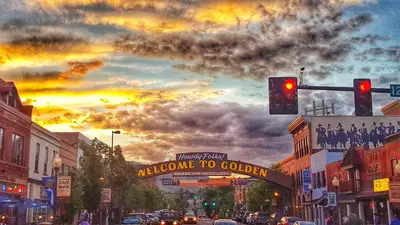 a street with a traffic light and a welcome to golden sign at Golden Condo Patio with MTN Views Walk to DT Golden and School of Mines in Golden