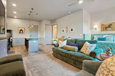 a living room with a couch and a table at Golden Condo Patio with MTN Views Walk to DT Golden and School of Mines in Golden