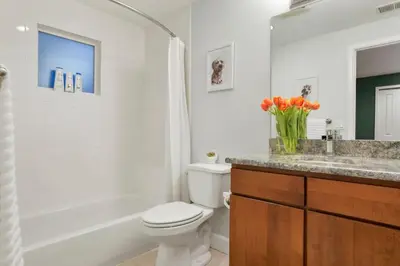 a bathroom with a toilet and a sink and a tub at Shakedown St HOT TUB Fire Pit and 4 Miles to DT in Denver