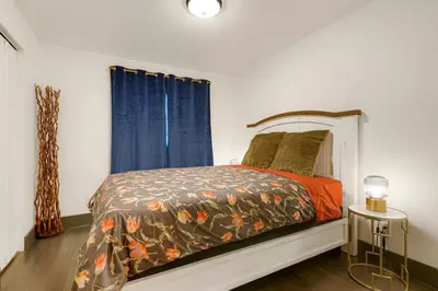 a bedroom with a bed and a window at Best Experience in Denver HOT TUB and FIRE PIT 4 miles to DT in Denver