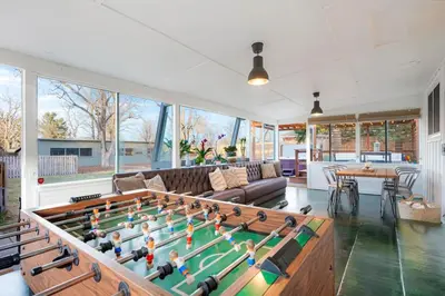 a living room with a large pool table at Best Experience in Denver HOT TUB and FIRE PIT 4 miles to DT in Denver