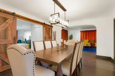 a dining room with a wooden table and chairs at Best Experience in Denver HOT TUB and FIRE PIT 4 miles to DT in Denver