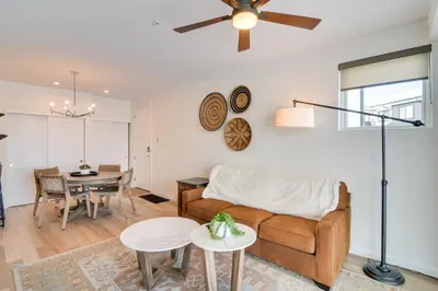 a living room with a couch and a table at 2 Mi to Fraser Tubing Hill Condo with Fireplace! in Fraser