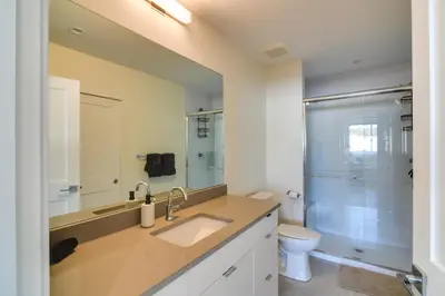 a bathroom with a sink and a toilet and a shower at 2 Mi to Fraser Tubing Hill Condo with Fireplace! in Fraser