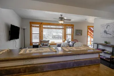 a living room with a couch and a table at The Loose Moose Lodge in Grand Lake